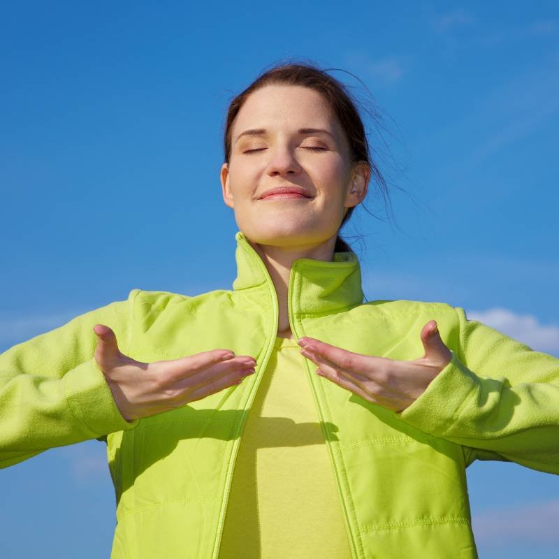 Women doing Breathing Exercises and meditation in open air