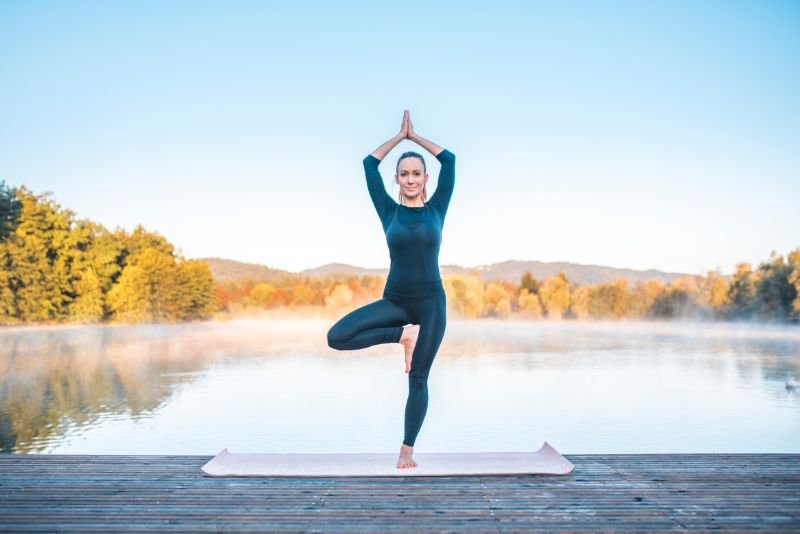 women doing mountain pose To open Solar Plexus Chakra